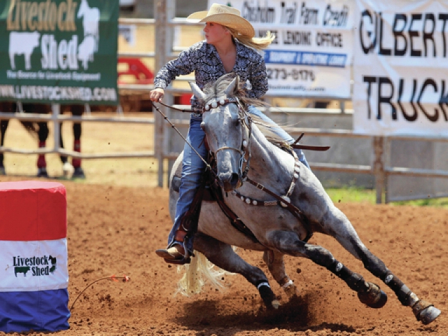 What penalty is assigned if a barrel racer knocks down a barrel? 